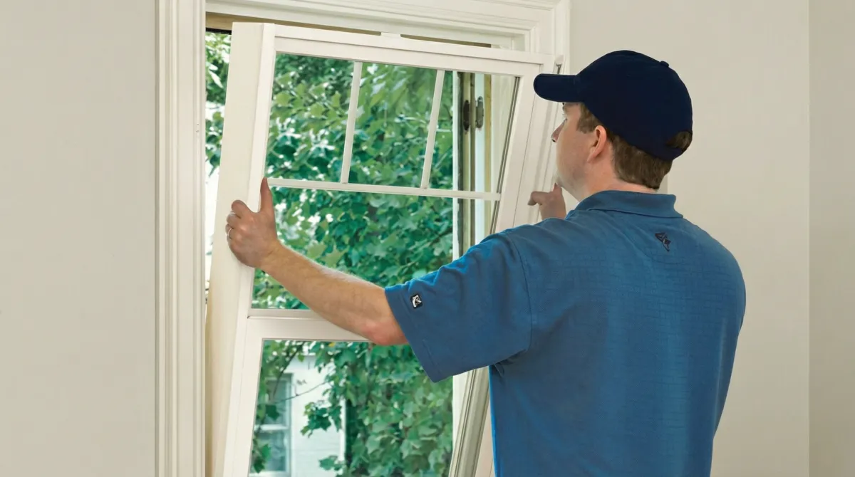 Professional contractors performing a residential window insulation and replacement service in Stamford, CT